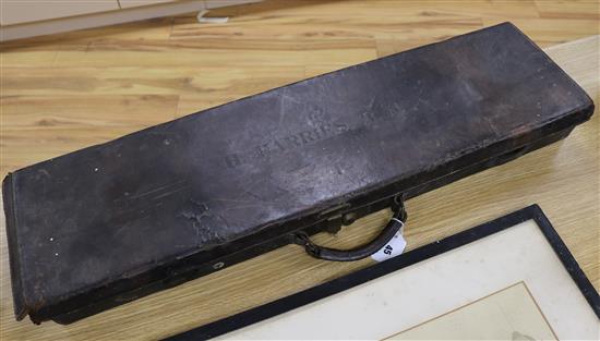A leather gun case 83cm long, 21.5cm wide